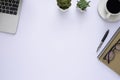 Workspace in office with white table. Top view from above of laptop with notebook and coffee. Desk for modern creative work of des Royalty Free Stock Photo