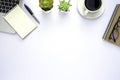 Workspace in office with white table. Top view from above of laptop with notepad and coffee. Desk for modern creative work of desi Royalty Free Stock Photo