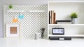 Workspace pegboard and shelves with office supplies.