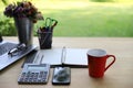 Workspace relaxing chill out work for office and coffee cup, laptop computer, smartphone , Calculator and other stationary on wood