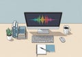 A workspace setup features a desktop computer displaying a colorful sound wave pattern. Below, a Royalty Free Stock Photo