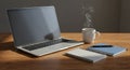 Workspace Setup: Laptop, Coffee, and Notebooks on Wooden Desk Royalty Free Stock Photo