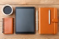 Workspace setup with tablet, notebooks, cup of coffee, and pen on wooden table Generative AI Royalty Free Stock Photo
