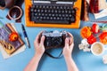 Workspace with vintage orange typewriter Royalty Free Stock Photo