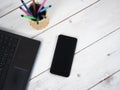 Workspace on table,Laptop pen box and mobilephone top view Royalty Free Stock Photo