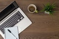 Workspace. Top view. Table desk with laptop, coffee, notepad, pen and plant with empty space background for design. Royalty Free Stock Photo