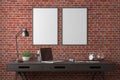 Workspace with two vertical posters mock up on red brick wall. Desk with drawers in interior of the studio or at home. Royalty Free Stock Photo