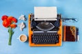 Workspace with vintage orange typewriter Royalty Free Stock Photo