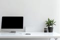 Workspace with a White Desktop and Empty Laptop Royalty Free Stock Photo