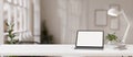 Workspace with a white-screen digital tablet mockup on a white table in a modern white room Royalty Free Stock Photo