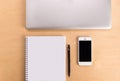 Workspace on wood table with laptop, sketchbook, pencil and telephone. Creative concept of a designer's work office desk. Royalty Free Stock Photo