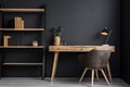 Workspace with wooden writing desk and chair against window near dark wall with shelf Royalty Free Stock Photo