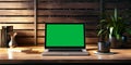 workstation setup, laptop on desk, horizontal view layout mockup with green screen laptop, ai generated Royalty Free Stock Photo