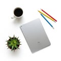 Workstation setup with tablet, coffee, and pencils isolated on white background Royalty Free Stock Photo