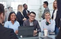 Workteam in office working on desktop computer Royalty Free Stock Photo