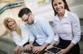 Workteam in office working together on laptop Royalty Free Stock Photo