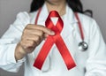 World aids day and national HIV AIDS and ageing awareness month in December with red ribbon on medical Royalty Free Stock Photo