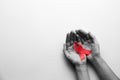 World AIDS disease day. Woman holding red awareness ribbon on white background, top view with space for text Royalty Free Stock Photo