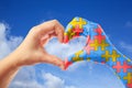 World Autism Awareness day, mental health care concept with puzzle jigsaw pattern on heart shape hands.
