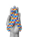 World Autism Awareness day with puzzle or jigsaw pattern ribbon isolated with clipping path on white background Royalty Free Stock Photo