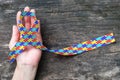 World Autism awareness day WAAD, April 2: Colorful Puzzle fabric ribbon logo color splashed on human hand background