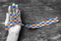 World Autism awareness day WAAD: Colorful Puzzle fabric ribbon logo color splashed on human hand background raising public support