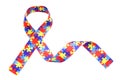 World Autism awareness and pride day with Puzzle pattern ribbon isolated on white