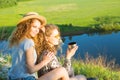 A world without borders. Stunning journey of two girls in the mountains. Happy traveler young couple resting in the Royalty Free Stock Photo