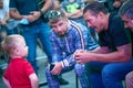 World boxing champion ALEXANDER USYK speaks with child