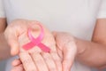 World Breast Cancer Day Concept,health care - woman wore pink t-shirt with Pink ribbon for awareness, symbolic bow color raising