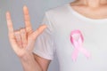 World Breast Cancer Day Concept,health care - woman wore pink t-shirt with Pink ribbon for awareness, symbolic bow color raising