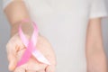 World Breast Cancer Day Concept,health care - woman wore pink t-shirt with Pink ribbon for awareness, symbolic bow color raising Royalty Free Stock Photo