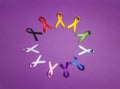 World cancer day concept, February 4. Circle of colorful awareness ribbons on purple background