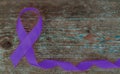 World Cancer Day concept. Lavender Ribbon on wooden background with copy space Royalty Free Stock Photo