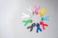 World cancer day February 4. colorful awareness ribbons; blue, red, green, black, grey, white, pink and yellow color for
