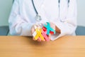 World cancer day, February 4. Doctor hold colorful ribbons, blue, yellow, red, green, white, pink and grey for supporting people Royalty Free Stock Photo