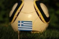 World Championship 2022. Euro 2020. Greek national flag. Greek soccer team. State flag of Greece on wooden stick in soccer field