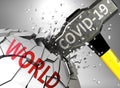 World and Covid-19 virus, symbolized by virus destroying word World to picture that coronavirus affects World and leads to crisis Royalty Free Stock Photo