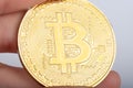 world cryptocurrency bitcoin coin in hand close up macro Royalty Free Stock Photo