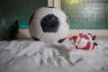 World cup at wintertime concept. Football Soccer ball on snowy decorated table with toy miniatures. New Year Christmas theme. Royalty Free Stock Photo