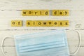 world day of slowness.words from wooden cubes with letters