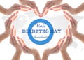 World diabetes day concept with blue circle symbolic logo among protective heart-shape hands for diabetic disease prevention Royalty Free Stock Photo