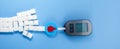 World diabetes day concept. Red blood drop in circle with Blood glucose test strip and Glucose meter. Top view Royalty Free Stock Photo