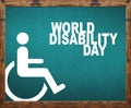 World disability day written on blue blackboard