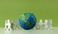 World Earth Day Concept. Green Energy, ESG, Renewable and Sustainable Resources. Environmental Care. Paper Cut as Group of People Royalty Free Stock Photo