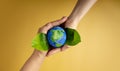 World Earth Day Concept. Green Energy, ESG, Renewable and Sustainable Resources. Environmental and Ecology Care. Hands of People Royalty Free Stock Photo