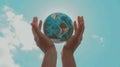 World Earth Day Concept. Green Energy, Hands of People Embracing a Handmade Globe. generative ai Royalty Free Stock Photo