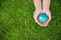 World Earth Day concept. Woman hand holding handmade globe Royalty Free Stock Photo