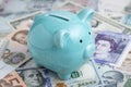 World economic, investment and saving with blue piggy bank on in