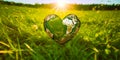 World environment day concept: Earth globe in heart shape with green grass and blue sky background. Royalty Free Stock Photo